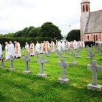 60 priests lead the procession to the grave