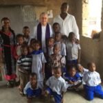 w.Fr. Phonsie Flatley SMA with school children in Nigeria